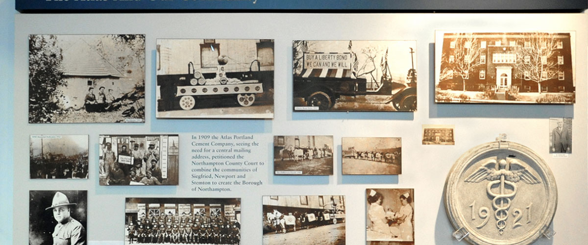 An exhibit at the Atlas Cement Memorial Museum includes artifacts such as a photo of a truck with a sign that reads 